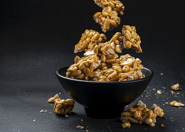 Peanut Kozinaki Falling Bowl Black Background With Copy Space 88281 4716