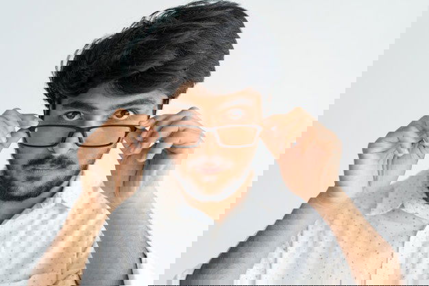 Mara Chekku Oil Manufacturer In Tamilnadu 2 Amazed Intelligent Indian Man Adjusting Glasses Believing His Eyes 1262 14119