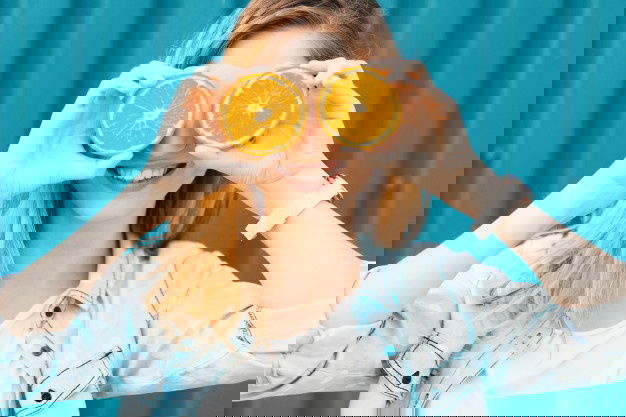 The Embarassing Story- How To Improve Your Immunity Double Times ! 5 Carefree Young Beautiful Girl Using Two Halfs Oranges Instead Glasses Her Eyes 158595 1358