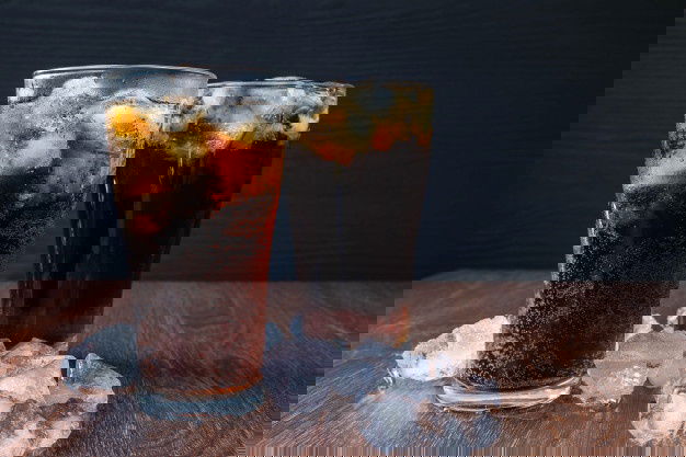 7 Foods To Get Away From Kidney Stones(Nephrolithiasis)! 5 Cola Glass Ice Cubes Wooden Background 51137 1912