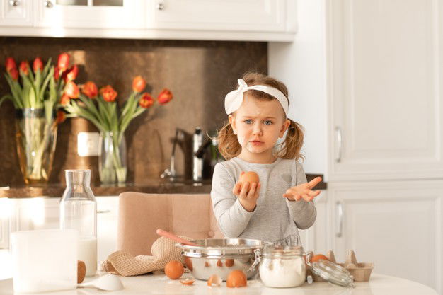 Surprised Child Girl With Flour Face Ready Cooking Cake Easter Party White Sunny Kitchen With Spring Flowers 424577 33