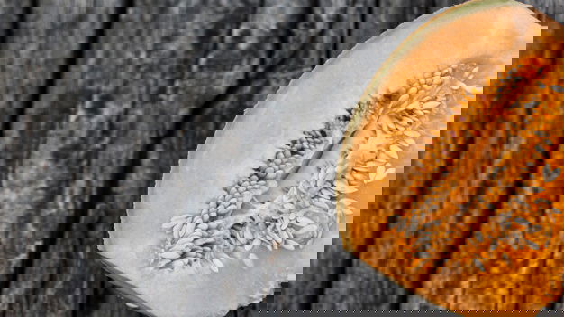 Can I Give My Baby Muskmelons? Is It Healthy? 3 Overhead View Halved Musk Melon Old Wooden Backdrop 23 2147905574