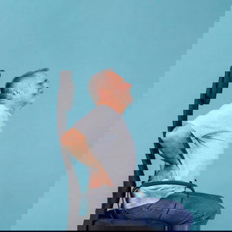 Senior Man Sitting Chair Having Back Pain Blue Background 23 2148032394