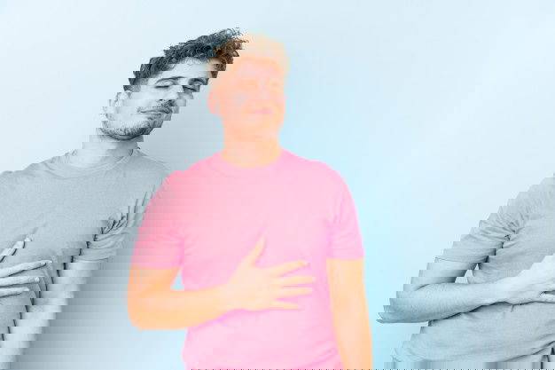 Young Blond Curly Hair Caucasian Man Isolated Touches Tummy Smiles Gently Eating Satisfaction Concept 1187 66100