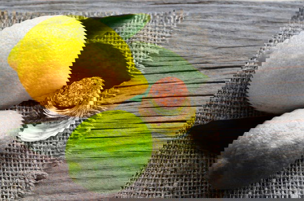 Lemon Essential Oil Glass Bottle With Fresh Lemon Lime Fruits Lemon Oil Spa Aromatherapy Bodycare Extract Oil Lemon Selective Focus 129199 197