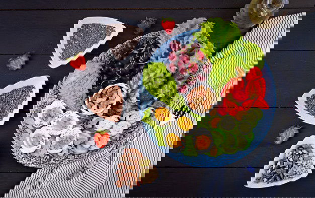 Plate With Paleo Diet Food Boiled Eggs Avocado Cucumber Nuts Cherry Strawberries Paleo Breakfast Top View 2829 17444