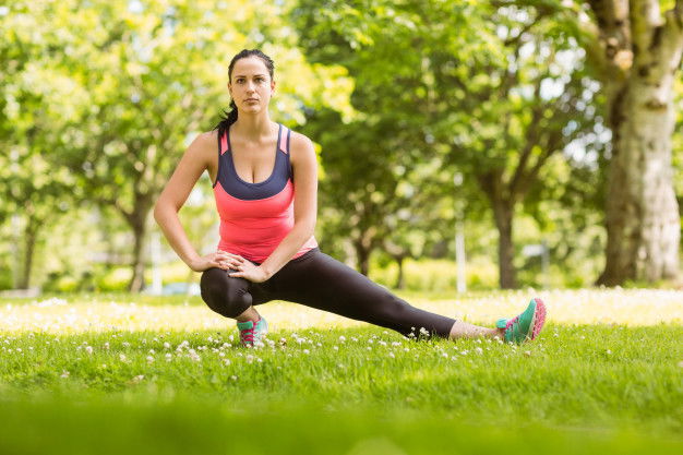 Fit Brunette Stretching Grass 13339 73907