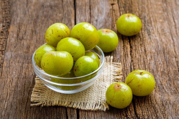 Fresh Indian Gooseberry Glass Bowl Wooden Board 96696 811