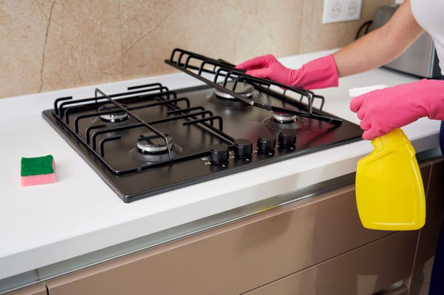 How To Clean Gas Stove Guide 1 Cleaning Gas Stove With Kitchen Utensils Household Concepts Hygiene Cleaning 130111 3586