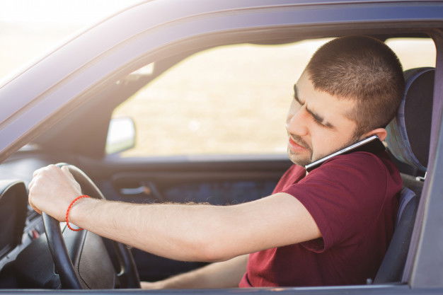 Male Driver With Concentrated Look Drives Car Talks Mobile Phone As Solves Important Problems Distantly Travels Long Distance 176532 9954