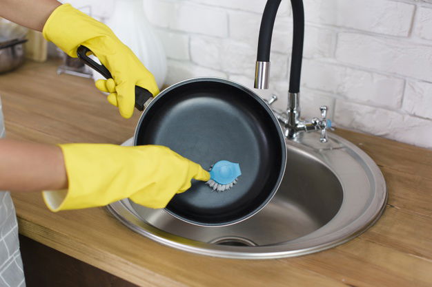 Person Hand With Yellow Glove Washing Pan With Brush Kitchen 23 2148222283