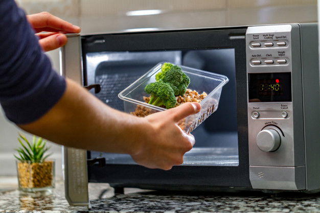 Woman S Hand Puts Plastic Container With Broccoli Buckwheat Microwave 122732 1179