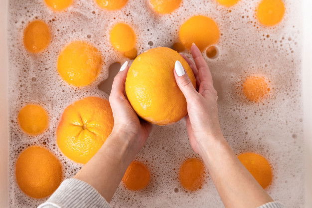 Woman Washing Ripe Orange Grapefruit Faucet Sink Kitchen Soaking Fruits Soapy Water Thoroughly Washes After Store 165285 553