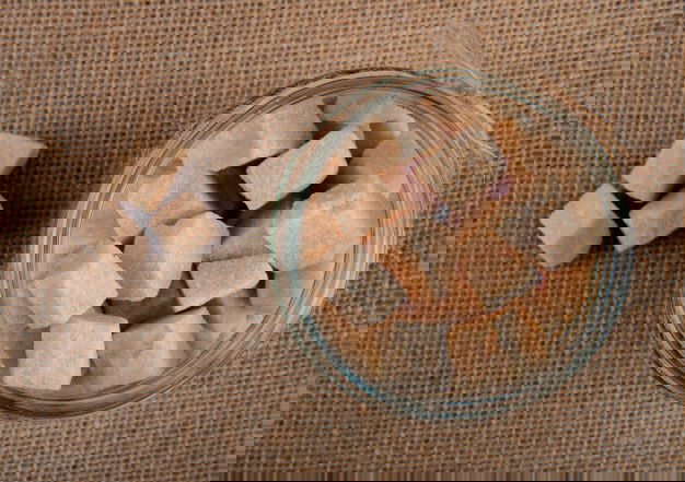 Top View Brown Sugar Cubes Glass Jar Sackcloth Texture Background 141793 7580