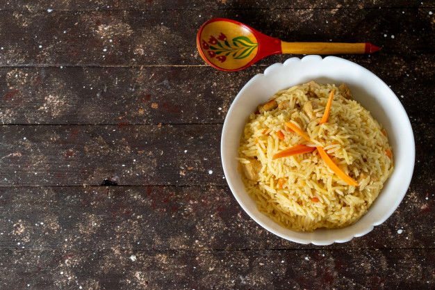 Try These 10 Khichdi Recipes That Your Babies Would Love! 6 Top View Cooked Rice Salted Peppered Tasty Inside Round Plate Rustic Brown 140725 24352