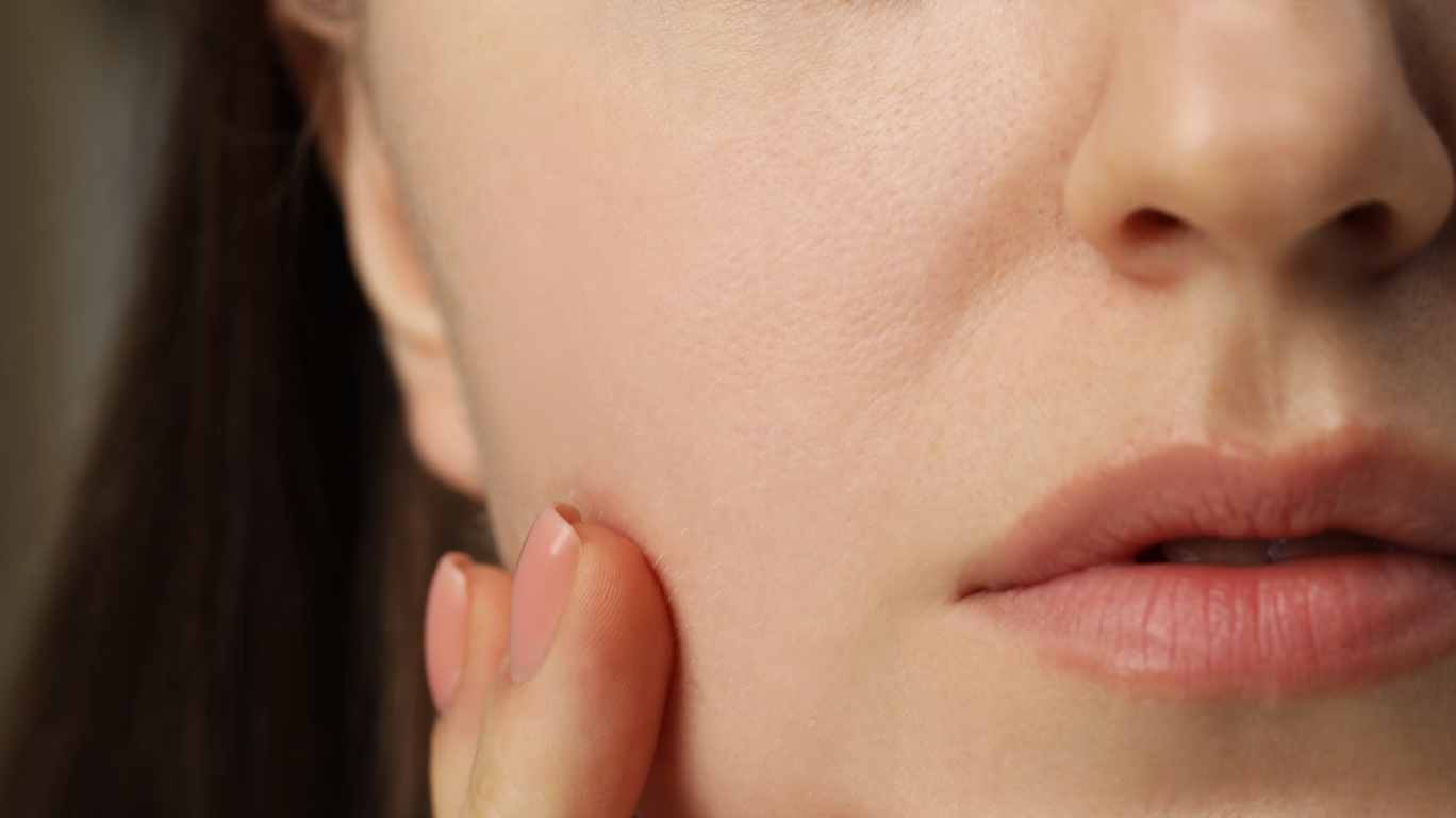 Close-Up Of Aloe Vera Gel Being Scooped Out From A Cut Leaf With A Spoon.&Quot;
