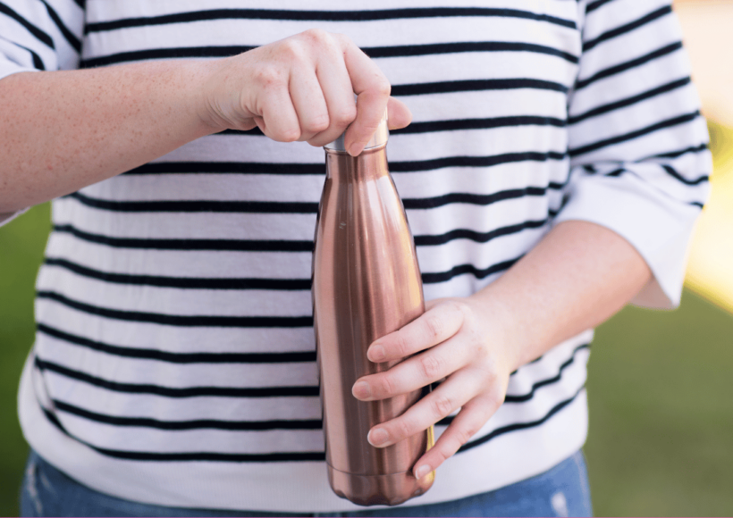 12 Stupendous Benefits Of Using A Copper Water Bottle! 10 A Sleek And Stylish Copper Water Bottle Placed On A Wooden Surface, Highlighting Its Health Benefits And Ayurvedic Advantages.