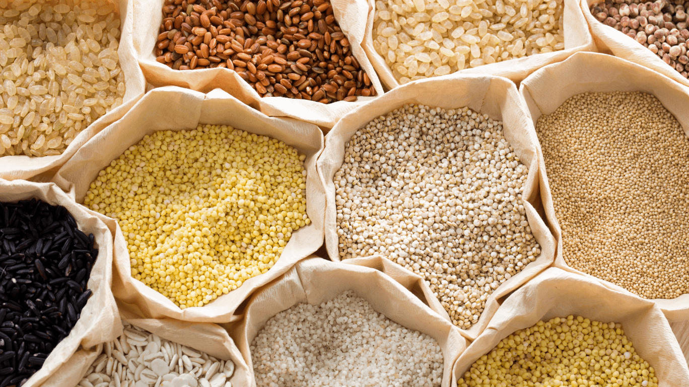 A Collection Of Various Types Of Siridhanya Grains, Showcasing Their Unique Colors And Textures, Commonly Known As Millets, Including Varieties Like Foxtail, Little, Barnyard, Kodo, And Pearl Millet.