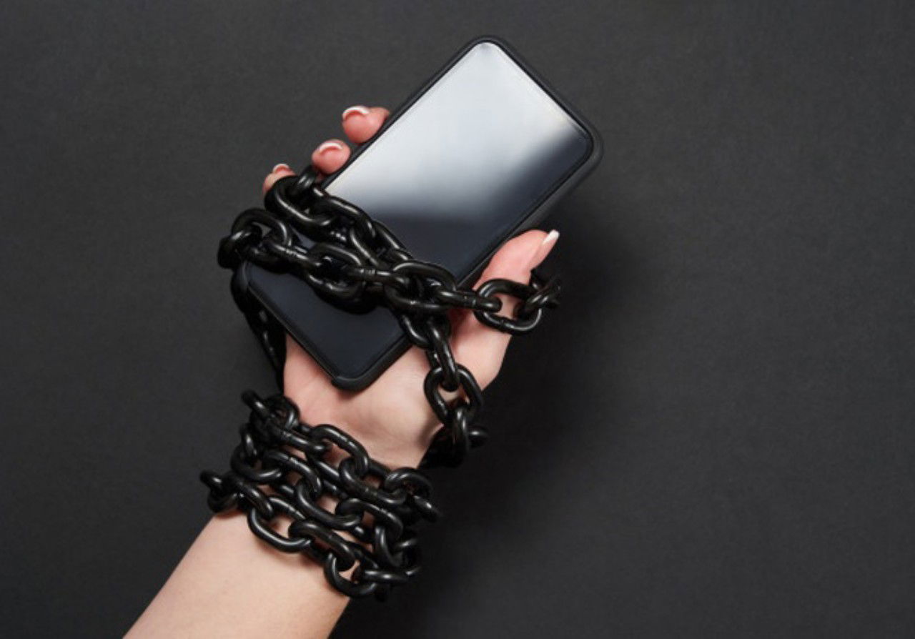 Iron Chain That Ties Together Hand Smartphone Concept Social Media Internet Addiction 130111