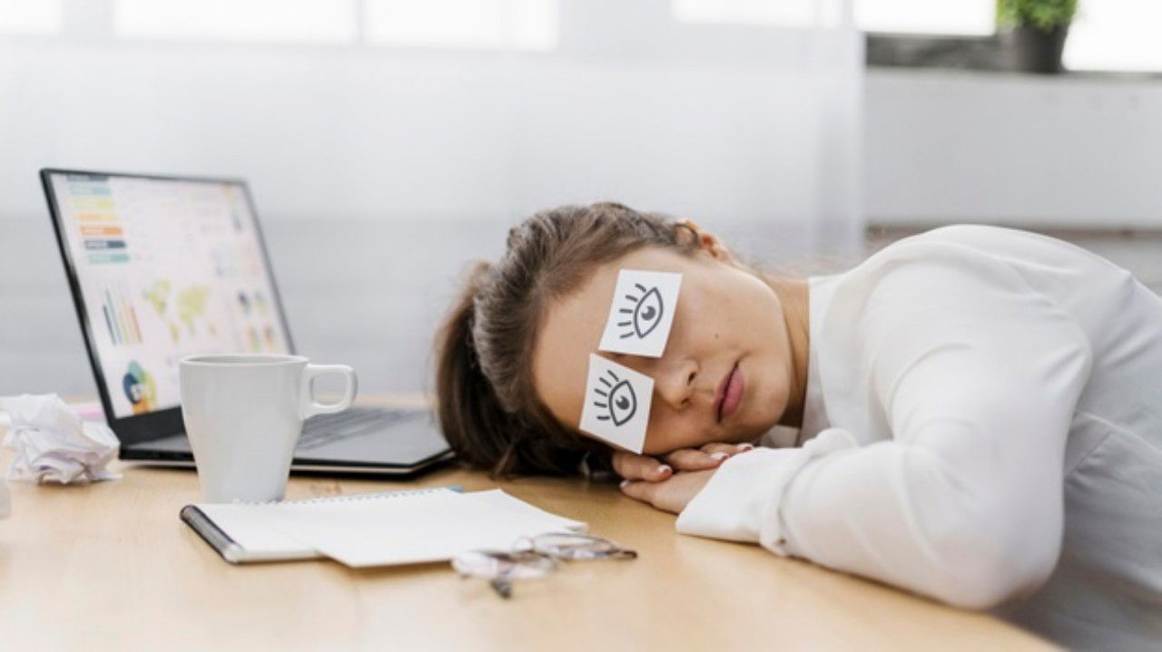 Tired Businesswoman Covering Her Eyes With Drawn Eyes Paper 23