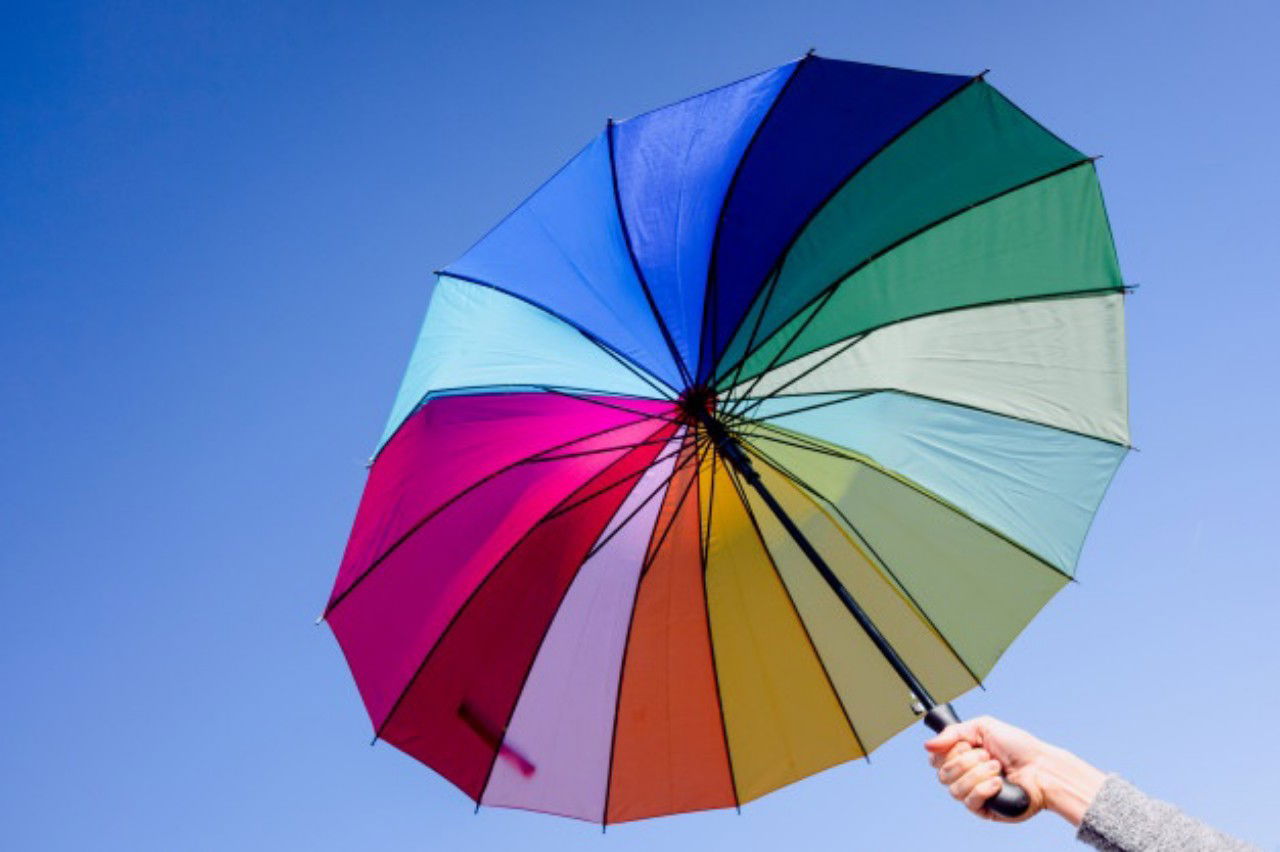 Woman Holds Umbrella Vibrant Colors With Background Clear Blue Sky 47726
