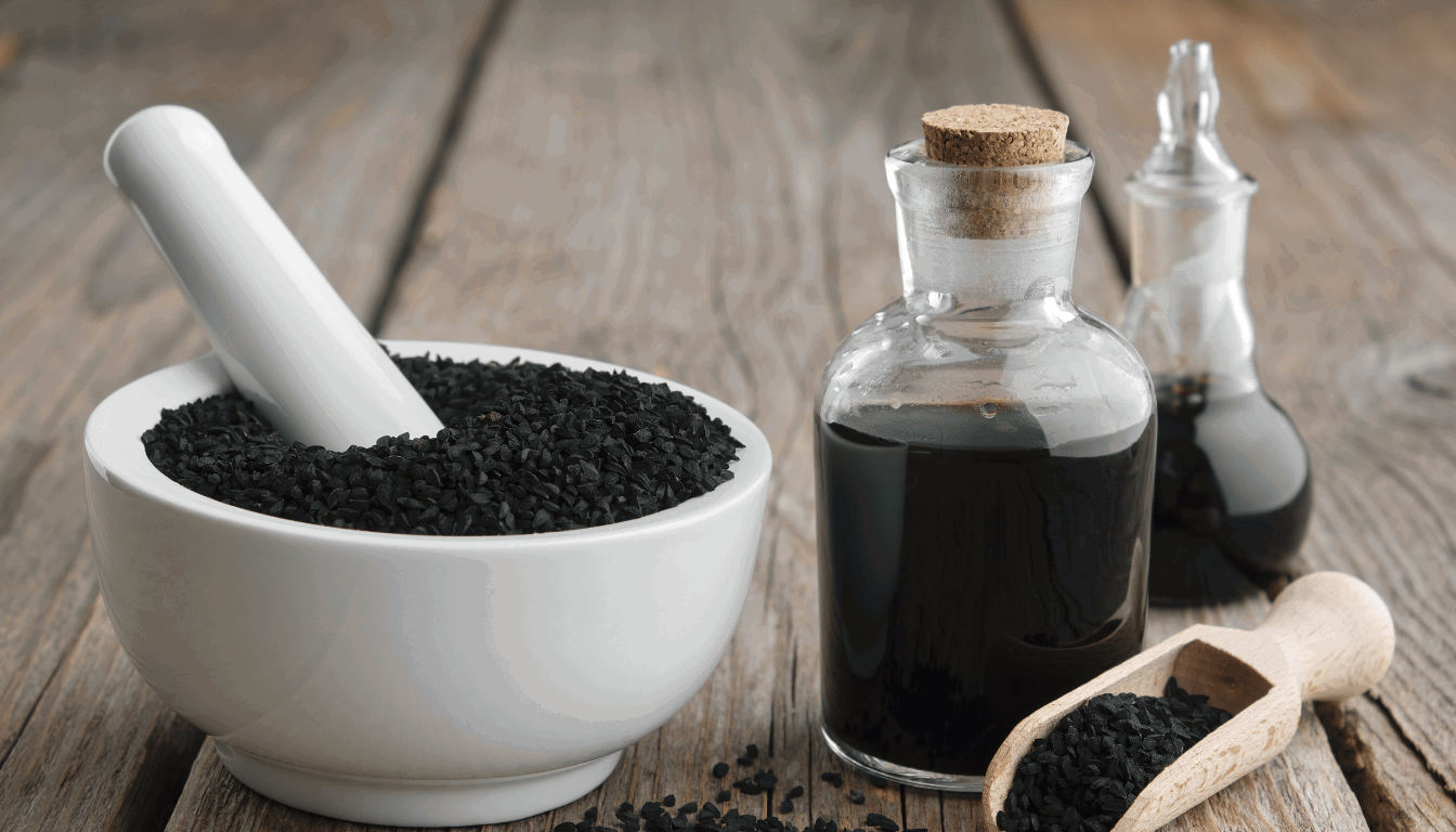 Karunjeeragam Oil- Its Mindblowing Benefits And Uses 2 Bottle Of Karunjeeragam Oil Surrounded By Black Cumin Seeds Used In Ayurvedic Healing