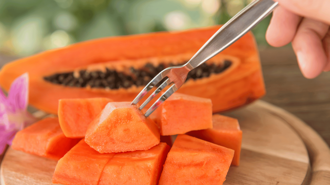Papaya And Jackfruit Placed Side By Side With A Red Warning Sign Indicating They Should Not Be Eaten
