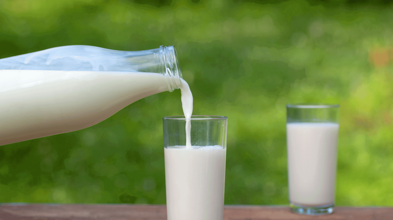 A Clear Glass Of Pure Milk With A Red Warning Sign, Indicating It Should Be Avoided After Eating Jackfruit