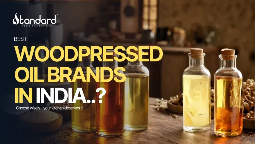 Best - Wood-Pressed Oil Brands In India 3 Best Wood Pressed Oil Brands In India Displayed In Glass Bottles With Rustic Kitchen Background, Highlighting Pure Traditional Cold Pressed Oils.